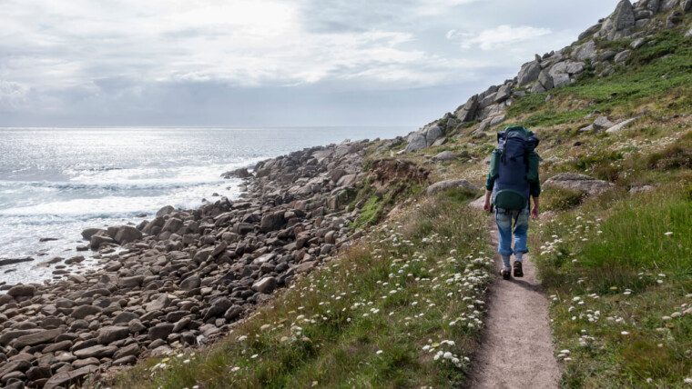 a person walking in Cornwall